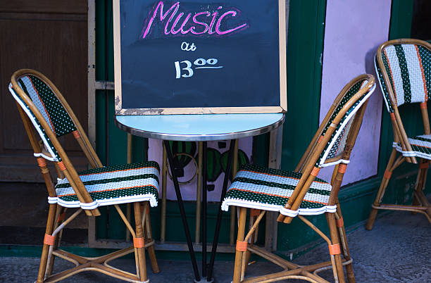 istock Paris, France: Sidewalk Cafe Table with Blackboard Sign: MUSIC 2207913589