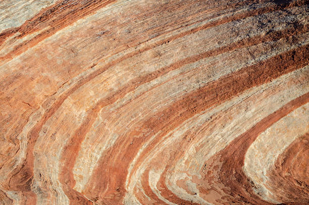 Looking through a natural bridge or arch nestled amongst the colorful rocks of Valley of Fire State Park located northeast of Las Vegas, Nevada.