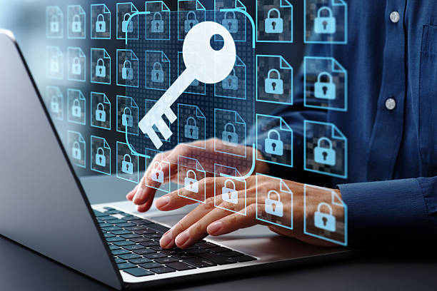 Encryption key management and secure document storage system. File data encryption and access control. Businessman using laptop computer. stock photo