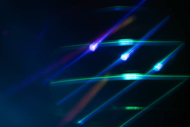 Colorful glow Light flare sparks texture. red orange rays on dark blue abstract overlay.