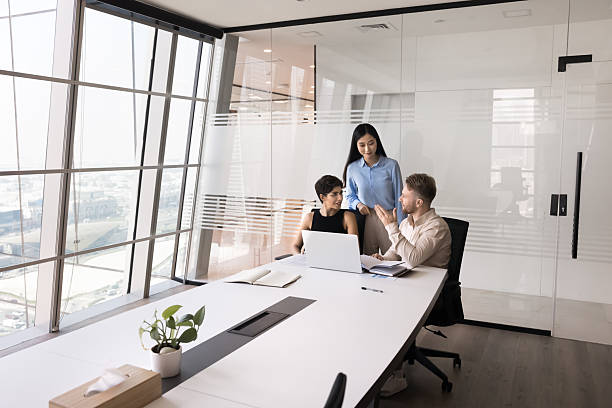 istock Diverse business project workgroup talking at laptop in meeting room 2207917324