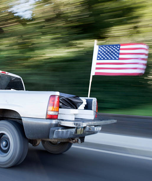 USA Oregon, Truck blurring by camera with an American flag