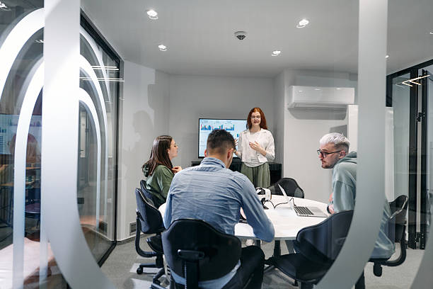 istock A diverse group of businessmen collaborates and tests a new virtual reality technology, wearing virtual glasses, showcasing innovation and creativity in their futuristic workspace 2207918124