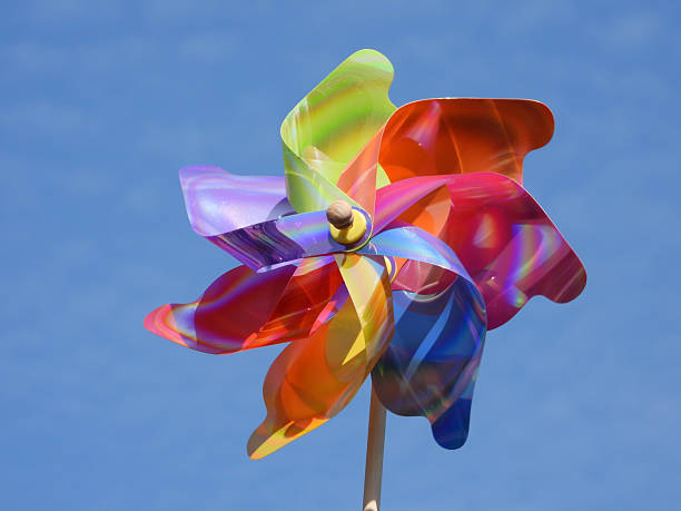 istock colorful plastic windmill toy rotating in the wind 2207920619