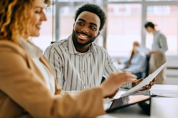 istock Two diverse entrepreneurs discussing growth strategy in a modern office 2207921030