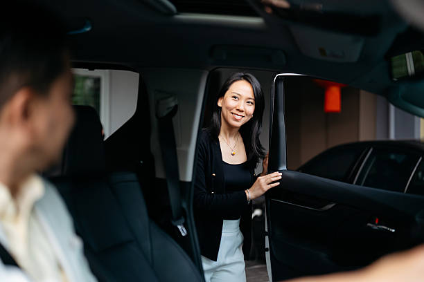 istock Asian couple going to work with car 2207921166