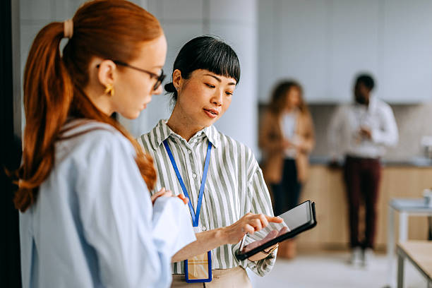 istock Two female colleagues analysing work data on a digital tablet at the office 2207921346
