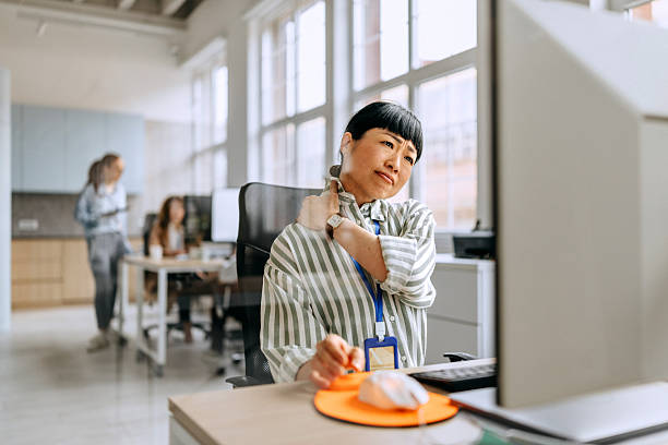 Businesswoman having neck ache due to work over load and bad posture