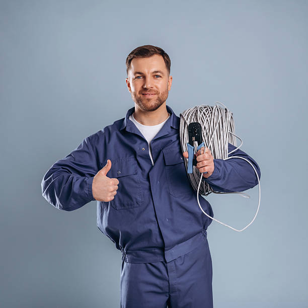 istock Worker is ready to install the internet connection. Handsome man is against background 2207921924