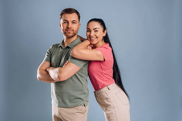 istock Embracing, standing and posing. Man and woman are in the studio 2207922033