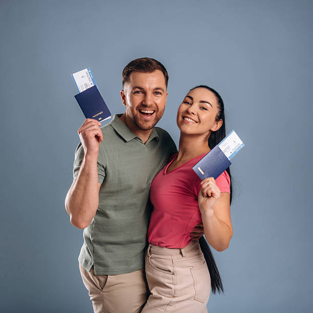 istock Documents and tickets are ready, vacation conception. Man and woman are in the studio 2207922136