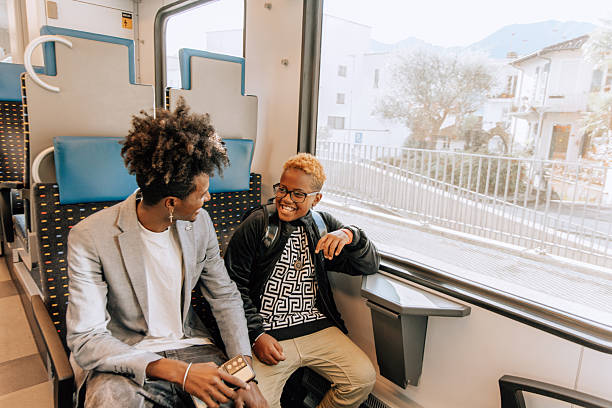 istock Father and Son Sharing a Joyful Moment on Train Journey 2207922891