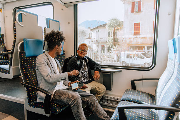 istock Father and Son Sharing a Joyful Moment on Train Journey 2207922894