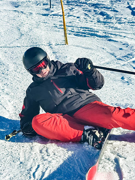 istock Adult skier accidentally falling down at skiing on slope 2207926084