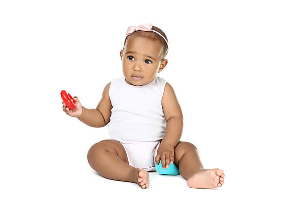 Multiracial baby girl against white background