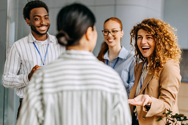 istock Smiling colleagues talking during coffee break at the office 2207927281