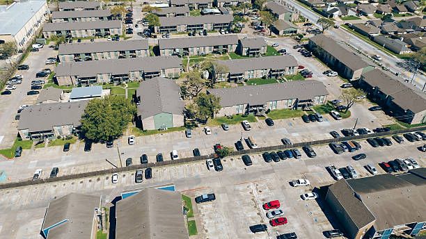 istock New construction multistory apartment building complex along Corporate Drive near Chinatown in Houston, Texas, uncovered parking lot, urban housing market in fast-growing mixed-use area, aerial 2207927373