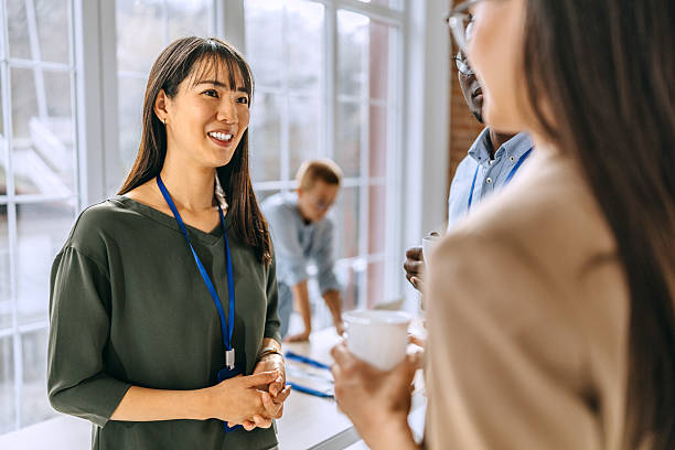istock Female colleagues having a coffee break during a conference event 2207927800