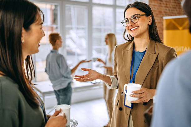 istock Female colleagues having a coffee break during a conference event 2207927825