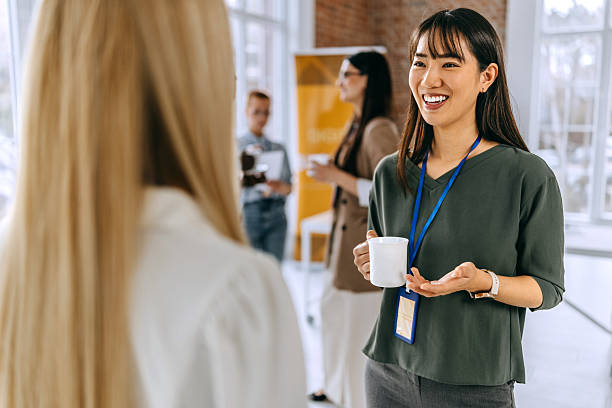 istock Female colleagues having a coffee break during a conference event 2207927845