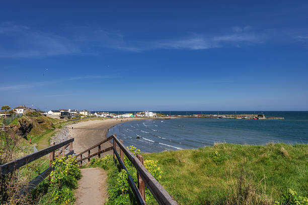 istock A beautiful and scenic coastal pathway that leads you directly to a tranquil beach and delightful harbor 2207928184