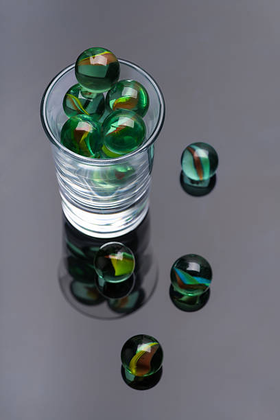 Colorful glass balls on a white background. The decor is made of multicolored glass.
