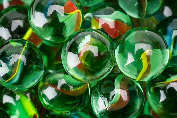 Colored glass marbles ball on black background