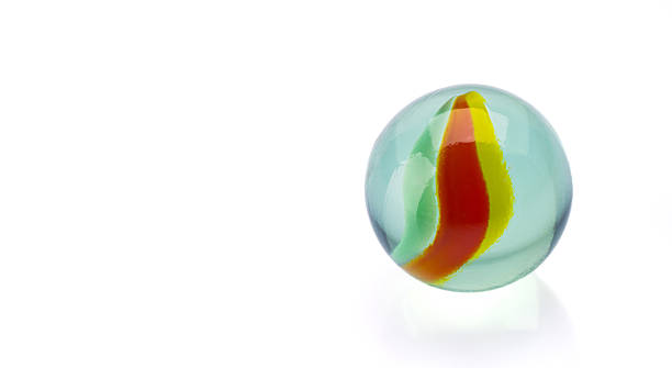 istock Colored glass marbles ball on white background 2207928775