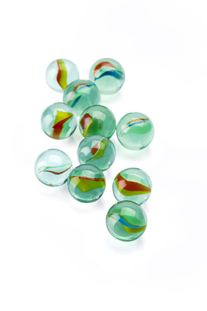 istock Colored glass marbles ball on white background 2207928788