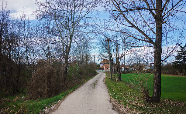 istock Old asphalted country road in Serbia 2207928790