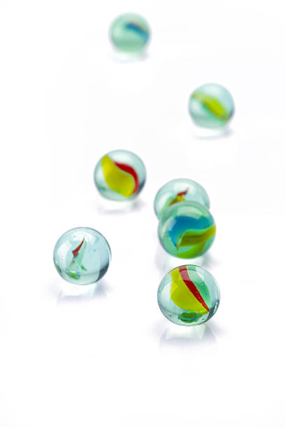 istock Colored glass marbles ball on white background 2207928815