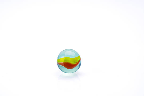 istock Colored glass marbles ball on white background 2207928848