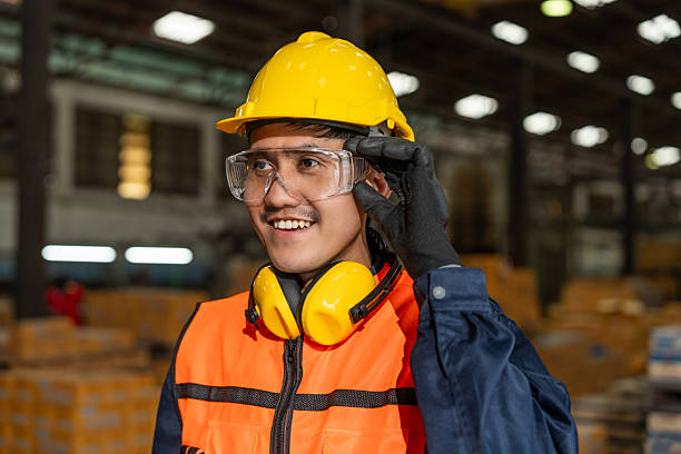 istock Close up technician engineer wearing and adjust protective safety glasses. Safety equipment for industry factory. Safety at work concept. 2207930689