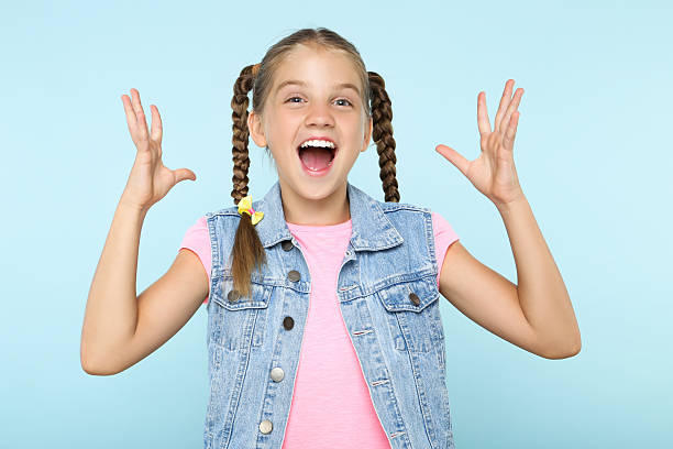 istock Young happy girl on blue background 2207930816
