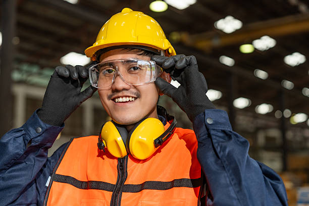 istock Close up technician engineer wearing and adjust protective safety glasses. Safety equipment for industry factory. Safety at work concept. 2207931690