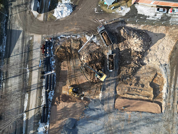 istock excavators and truck working in construction site 2207932712