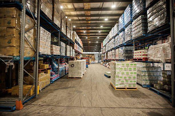 istock Inside Warehouse with Rows of Shelves and Stocked Merchandise 2207932942