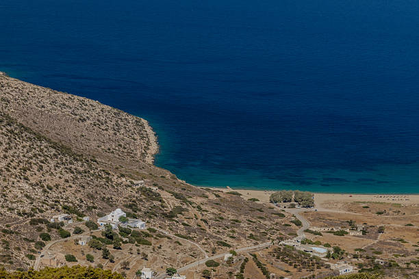View of a stunning panoramic view of the turquoise sandy Agia Theodoti beach in Ios Greece