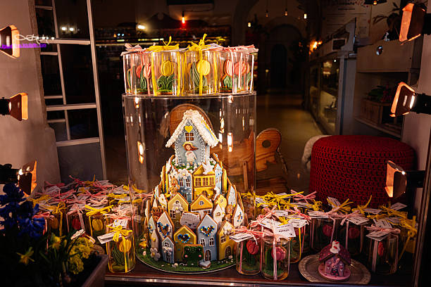 Lviv, Ukraine - March 31, 2025: Showcasing a detailed gingerbread house surrounded by beautifully wrapped decorative confections.