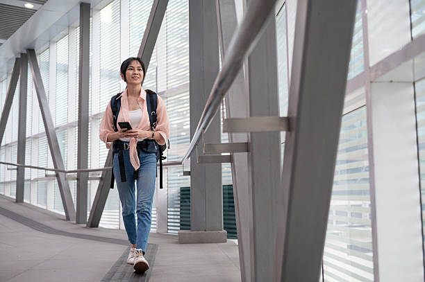 istock On the Move: A Happy Backpacker’s Journey Through the Train Terminal 2207938720