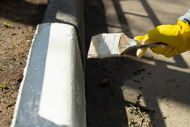 istock Painting border with white paint. Marking road. Landscaping. 2207940505