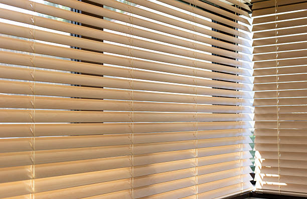 istock Wood venetian beige blinds on the window 2207940851