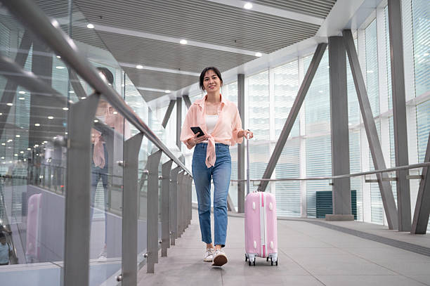 istock Ready to Fly: A Traveler’s Joyful Airport Stroll 2207942465