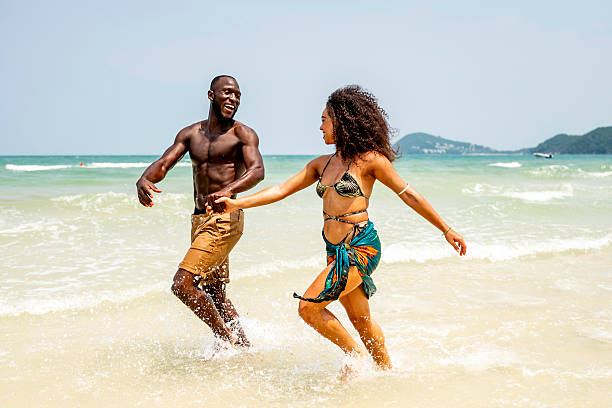 istock Happy Couple Enjoying a Fun Day at the Beach 2207944267