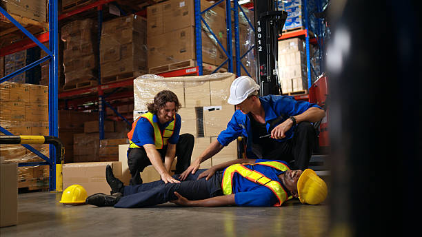 istock A group of warehouse workers were involved in an accident while on duty, Coworkers offered assistance and first aid 2207945234