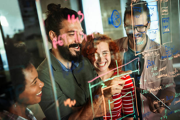 istock Group of business people and software developers working as a team in office 2207945389