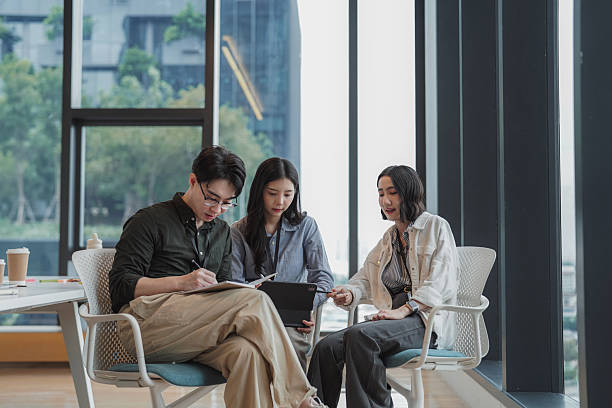istock Group of coworkers discussing project performance during a team meeting 2207945884