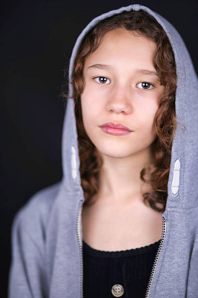 istock Ten year old brunette wearing a hoodie 2207945969