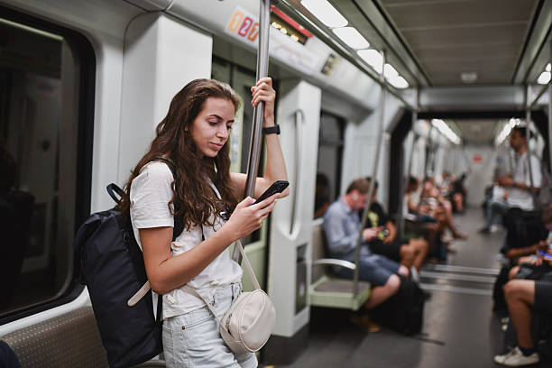 istock Female Holding Handle for Balance While Checking Maps on Smart Phone 2207948082