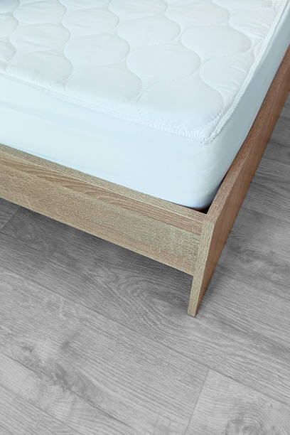 istock White mattress on the bed. Fragment. Vertical photo. 2207948357